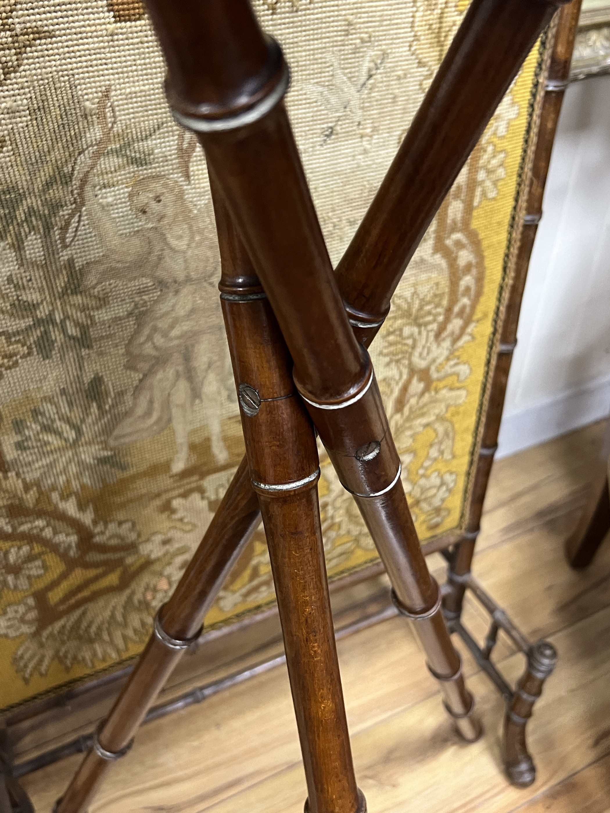 A Victorian faux bamboo firescreen and folding tripod plant stand, width 64cm, height 106cm